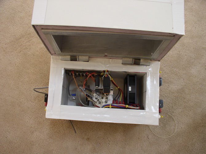 From Progress Report #1, a view inside the calorimeter showing the components. The cell is in the center, the GM detector is on the left, and the fan is on the right.